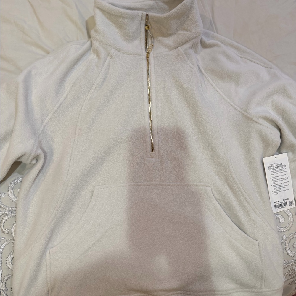 Scuba Tumbled Fleece Funnel-
Neck Half Zip
Colour Bone/Gold
Size XL/XXL - Picture 7 of 10